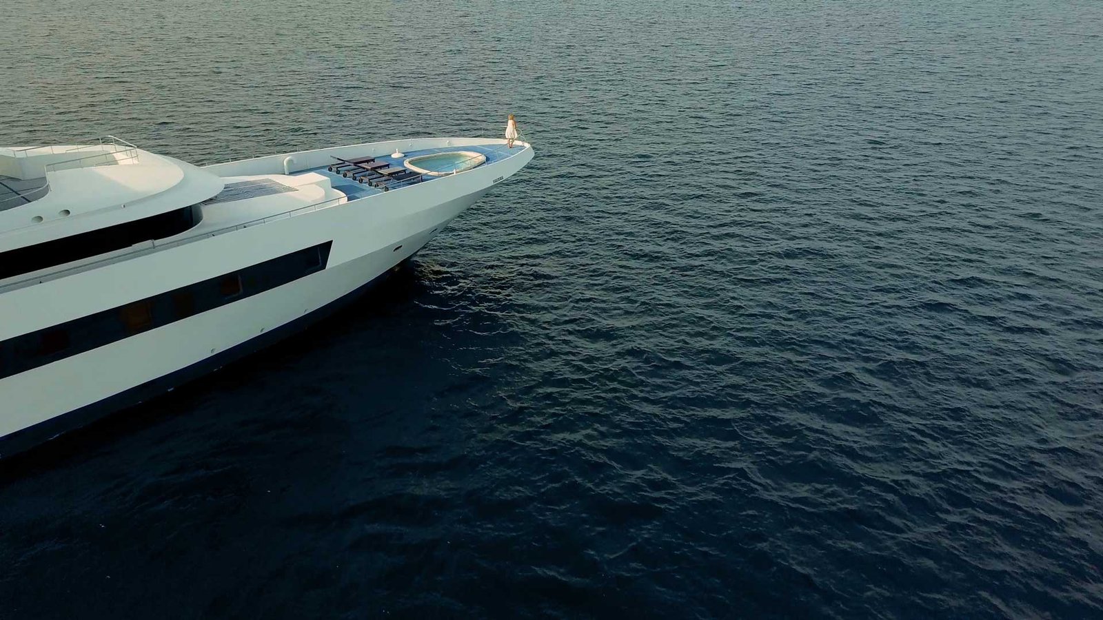 Woman on private luxury superyacht bow